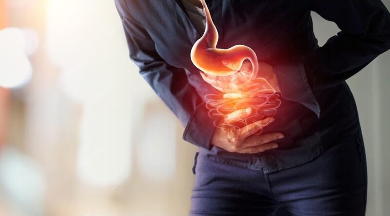 Person suffering from stomach indigestion and abdominal pain after eating