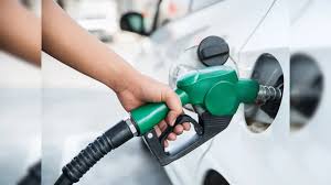 Premium petrol prices in India increased at fuel station display board