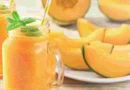 Fresh muskmelon juice in glass with slices, healthy summer drink