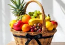 Fresh summer fruits including watermelon, mango, muskmelon, oranges, grapes, bananas, and kiwi arranged on a table for healthy hydration and nutrition.