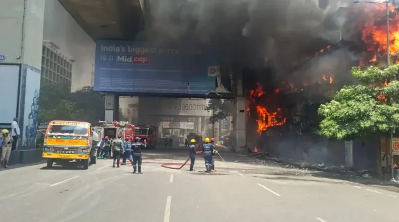 Hydraa Commissioner Ranganath inspecting the Maitrivanam fire accident site and reviewing safety violations with officials and affected residents in Hyderabad.
