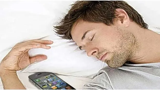 Mobile phone under pillow while sleeping poses safety risks